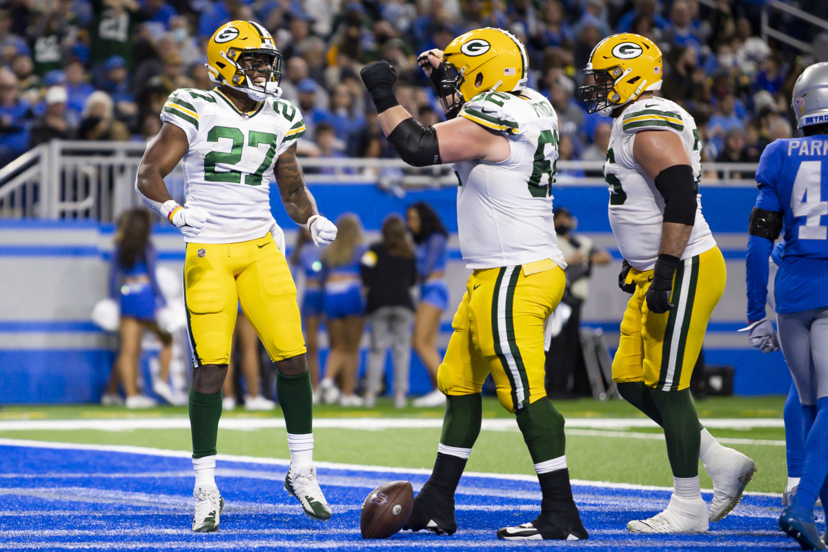 Jan 9, 2022; Detroit, Michigan, USA; Green Bay Packers running back Patrick Taylor (27) celebrates his touchdown against the Detroit Lions during the second half at Ford Field. Mandatory Credit: David Reginek-USA TODAY Sports (Chicago Bears)