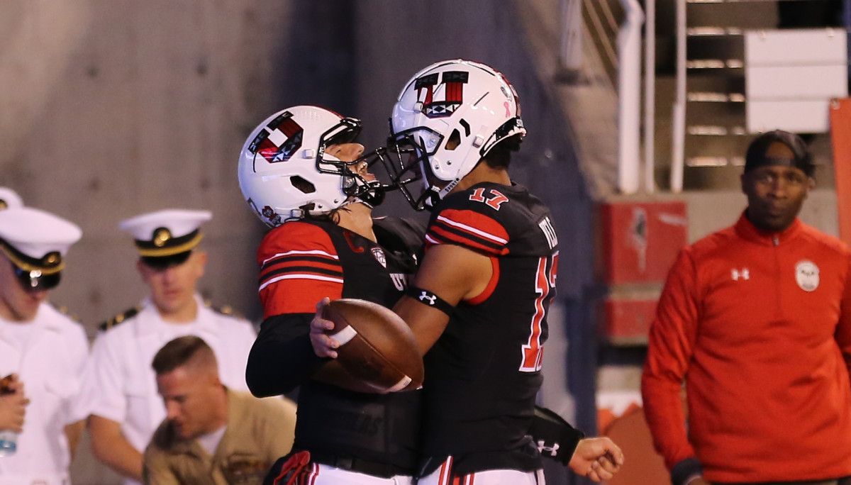 Utah Utes quarterback Cameron Rising (7) celebrates his touchdown with wide receiver Devaughn Vele (17) during the first quarter against the Arizona State Sun Devils at Rice-Eccles Stadium.