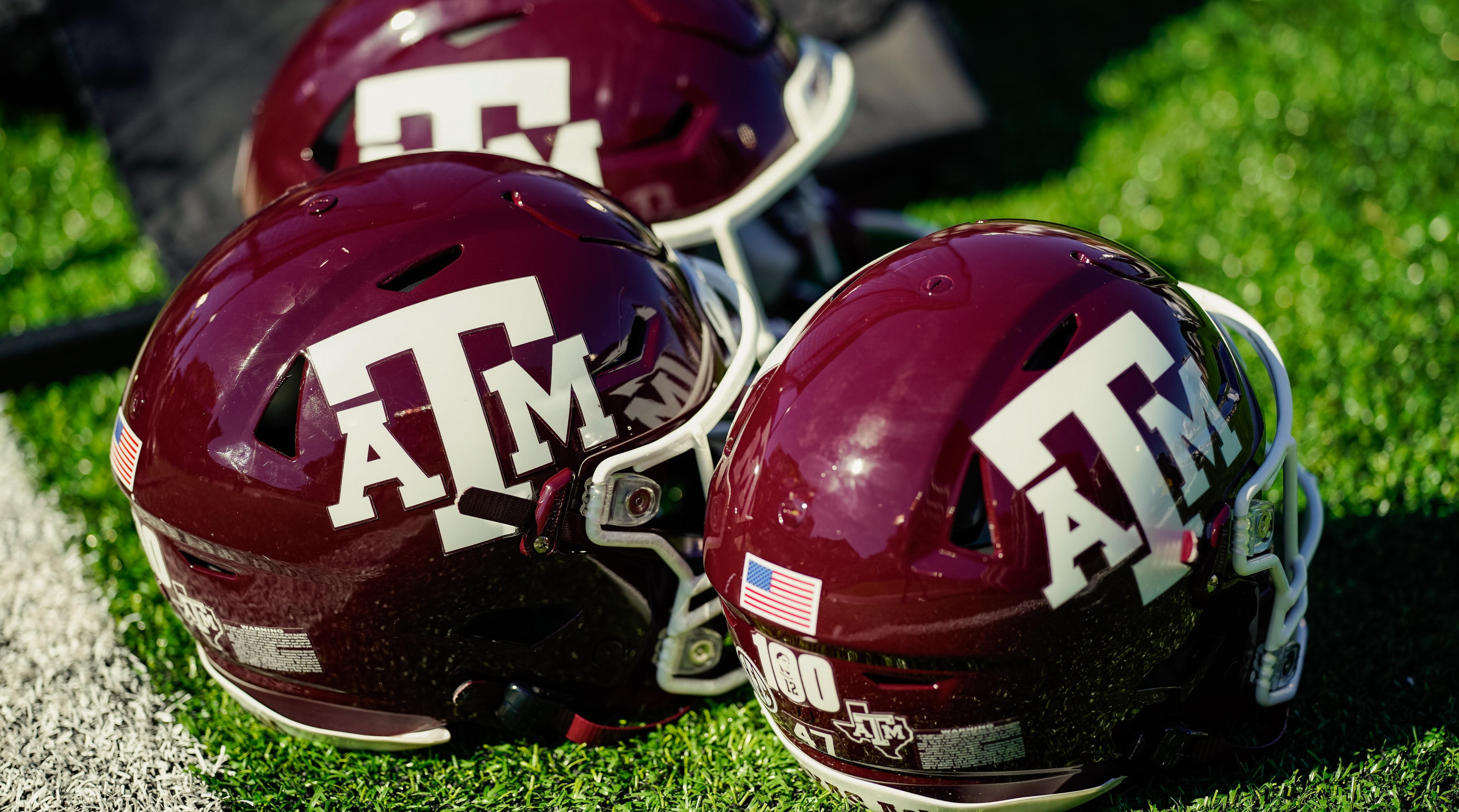 A detailed view of Texas A&M Aggies helmets on the sideline.