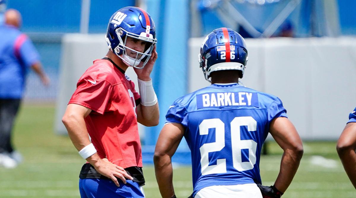 New York Giants quarterback Daniel Jones (8) and running back Saquon Barkley (26) on the field for mandatory minicamp at the Quest Diagnostics Training Center on Tuesday, June 7, 2022, in East Rutherford.