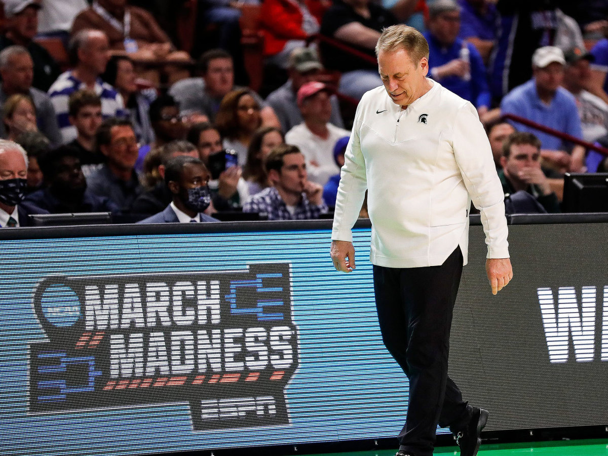 Tom Izzo looks down while pacing the sideline