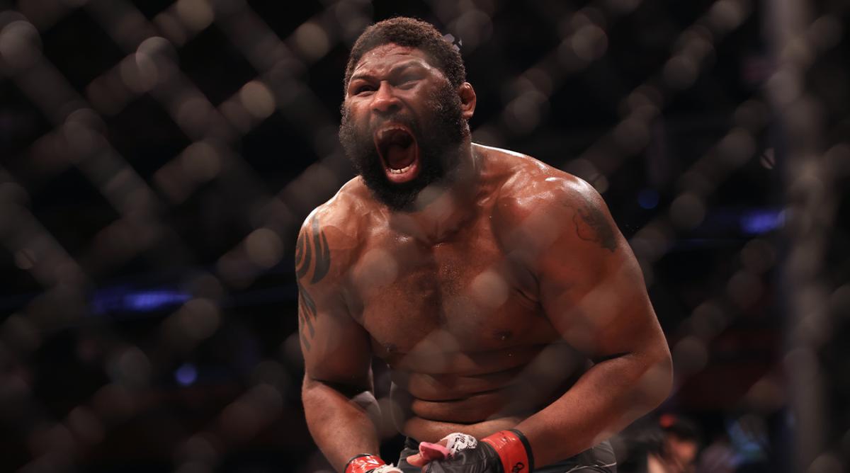 Mar 26, 2022; Columbus, Ohio, UNITED STATES; Curtis Blaydes (red gloves) reacts to defeating Chris Daukaus (blue gloves) during UFC Fight Night at Nationwide Arena.