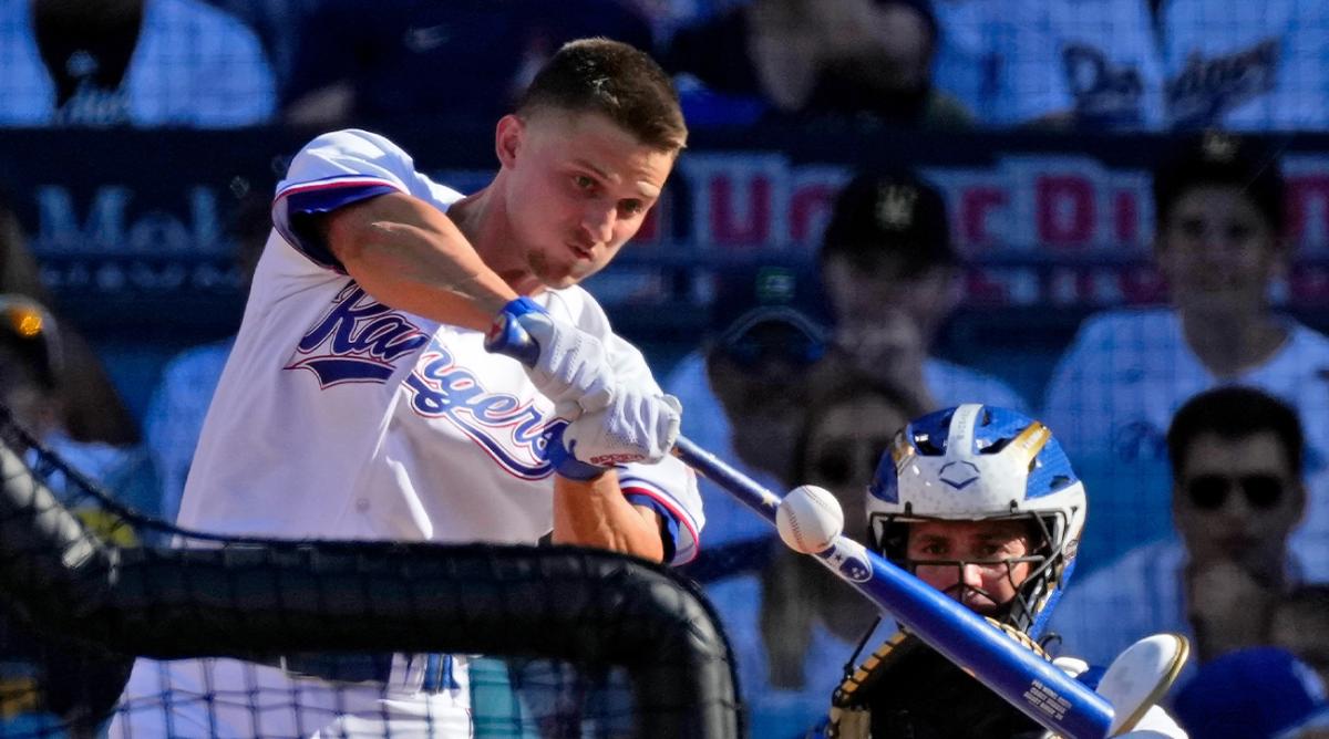 Jul 18, 2022; Los Angeles, CA, USA; Texas Rangers shortstop Corey Seager (5) hits in the first round during the 2022 Home Run Derby at Dodgers Stadium.
