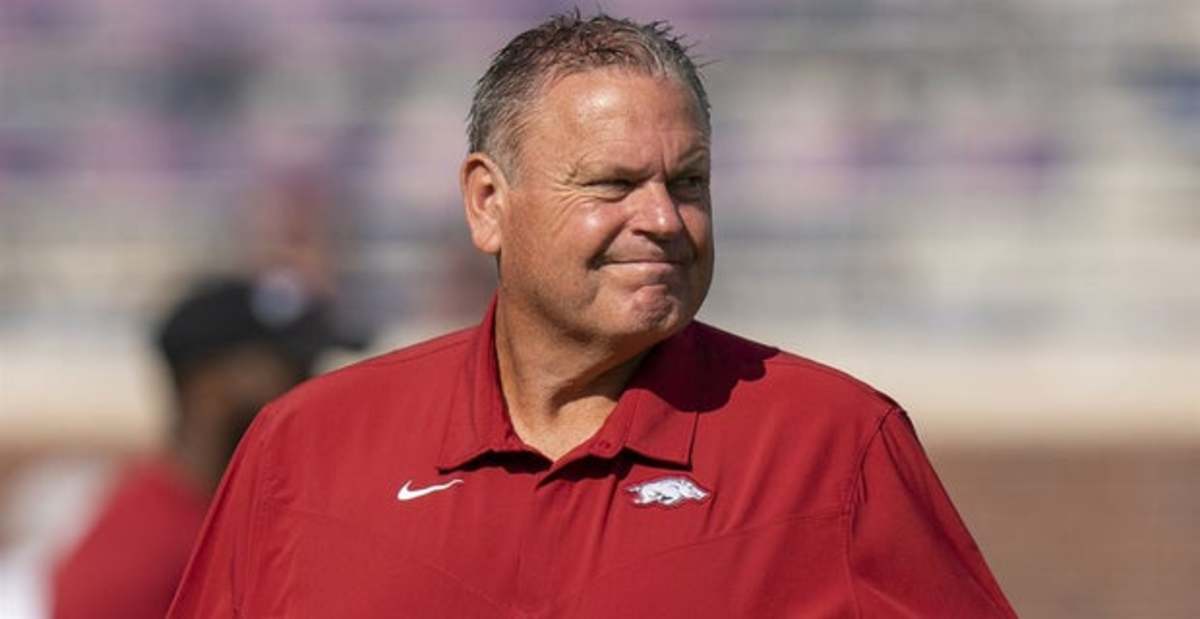 Arkansas Razorbacks football coach Sam Pittman on the sidelines before a college football game in the SEC.