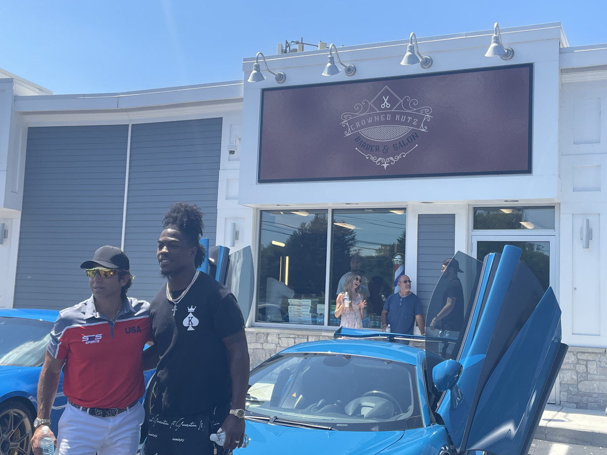 Sean Stellato and Brandon King in front of Crowned Kutz, Foxboro's latest barbershop and salon. (Ethan Hurwitz/Patriots Country)