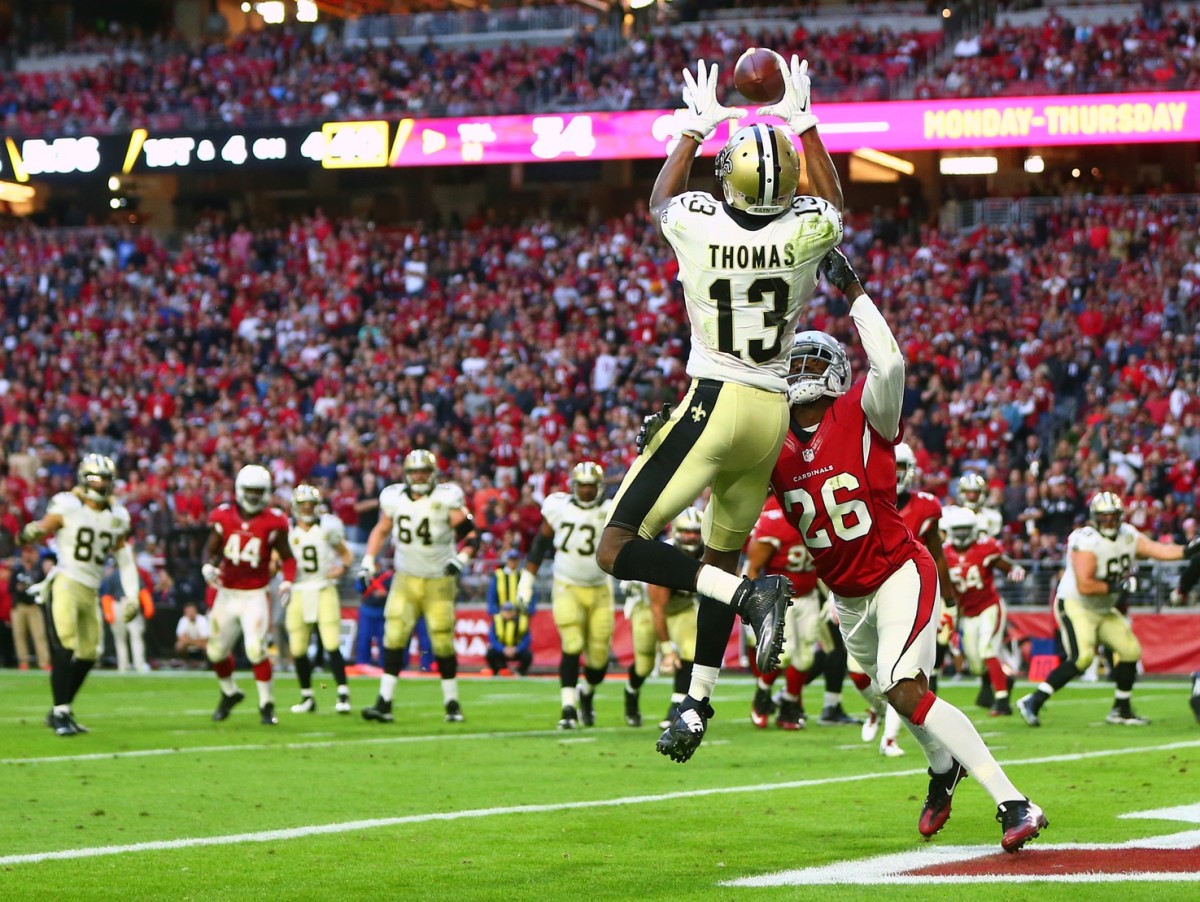 Dec 18, 2016; New Orleans Saints wide receiver Michael Thomas (13) catches a touchdown against the Arizona Cardinals cornerback Brandon Williams (13). Mandatory Credit: Mark J. Rebilas-USA TODAY Sports