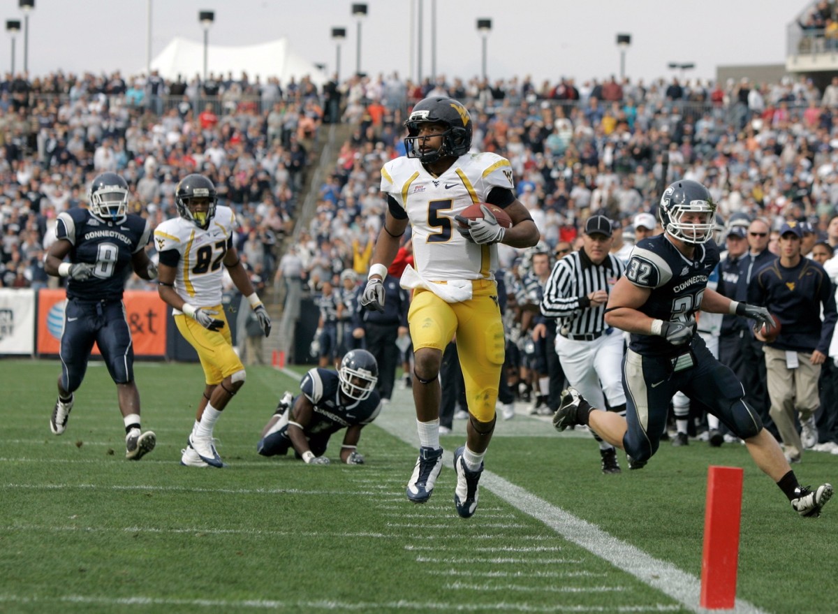 Nov 1, 2008; East Hartford, CT, USA; West Virginia Mountaineers quarterback Pat White (5) runs the ball for a touchdown in the second quarter against the Connecticut Huskies at Rentschler Field.