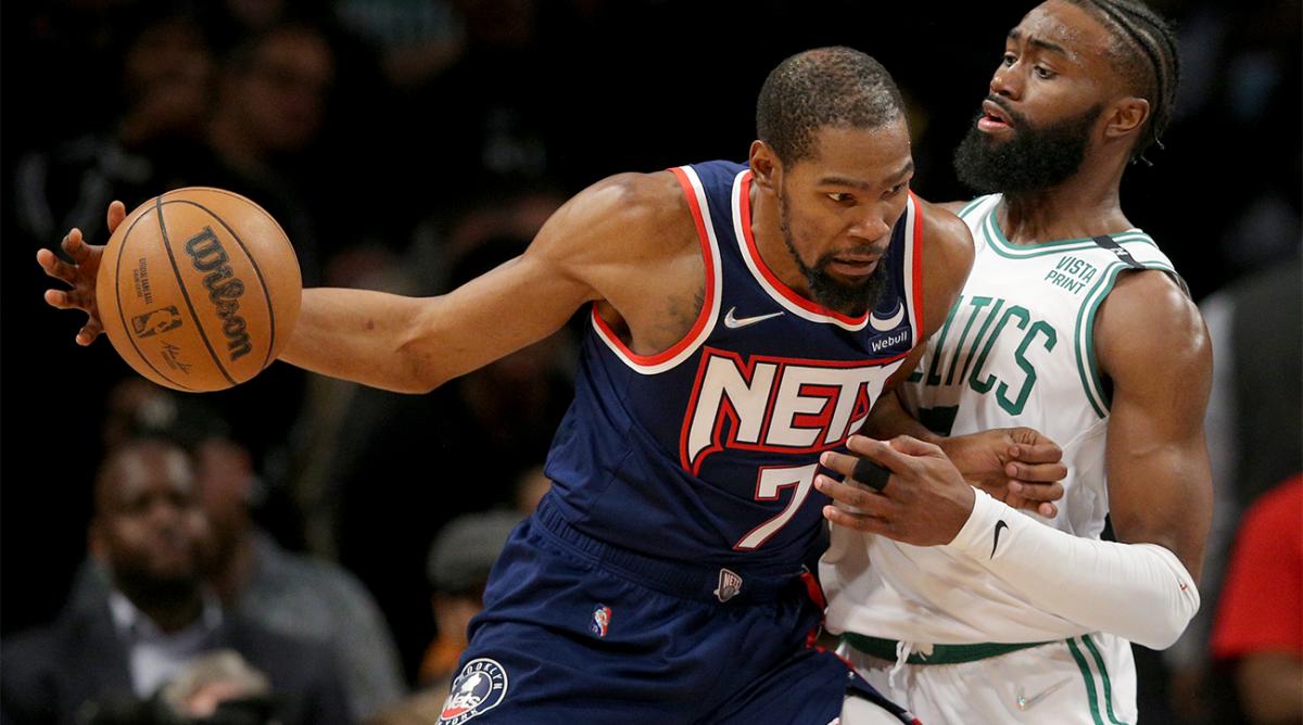 Apr 25, 2022; Brooklyn, New York, USA; Brooklyn Nets forward Kevin Durant (7) controls the ball against Boston Celtics guard Jaylen Brown (7) during the fourth quarter of game four of the first round of the 2022 NBA playoffs at Barclays Center. The Celtics defeated the Nets 116-112 to win the best of seven series 4-0.