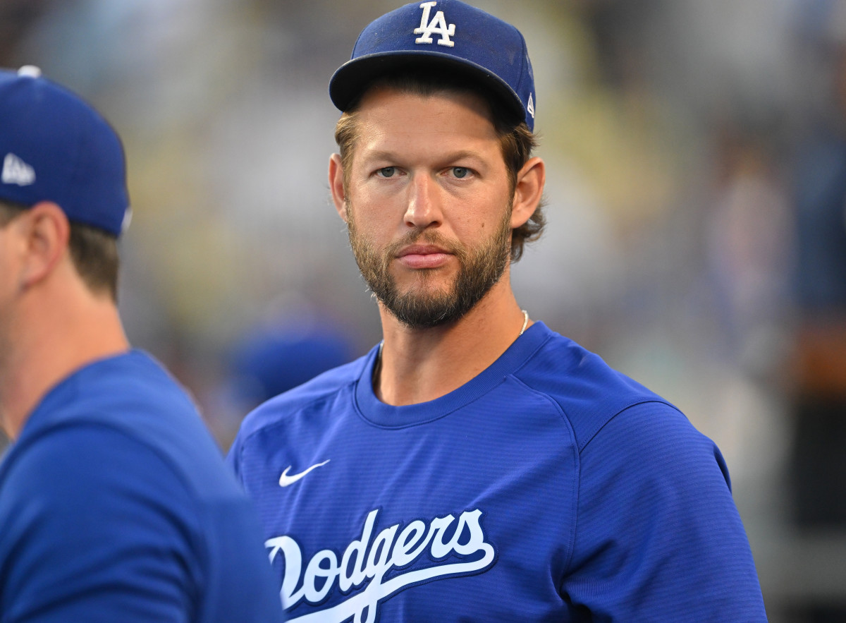 Jul 25, 2022; Los Angeles, California, USA; Los Angeles Dodgers starting pitcher Clayton Kershaw (22) looks on from the dugout against the Washington Nationals at Dodger Stadium. Mandatory Credit: Jayne Kamin-Oncea-USA TODAY Sports