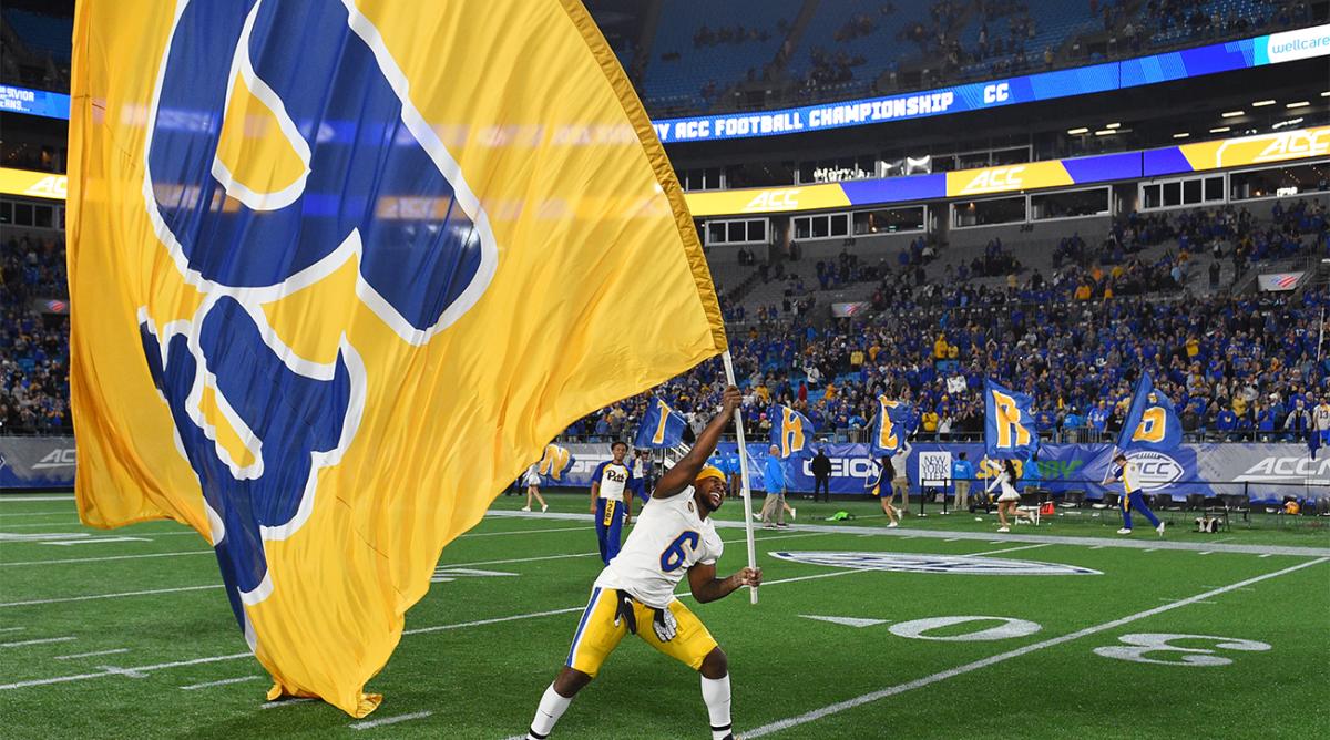 Dec 4, 2021; Charlotte, NC, USA; Pittsburgh Panthers defensive lineman John Morgan III (6) with the Pittsburgh flag after winning the ACC championship game at Bank of America Stadium.