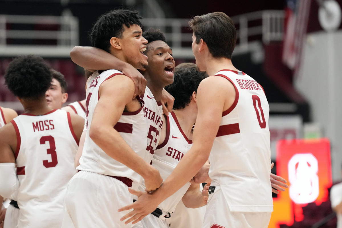 Stanford Cardinal forward Harrison Ingram (55) celebrates with forwards Spencer Jones (14) and Neal Begovich (0) after the game against the USC Trojans at Maples Pavilion.
