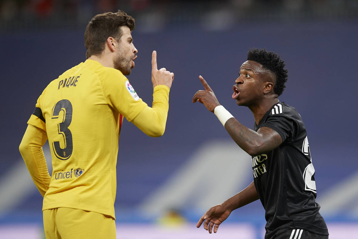 Gerard Pique argues with Vinicius Junior after accusing the Real Madrid player of diving