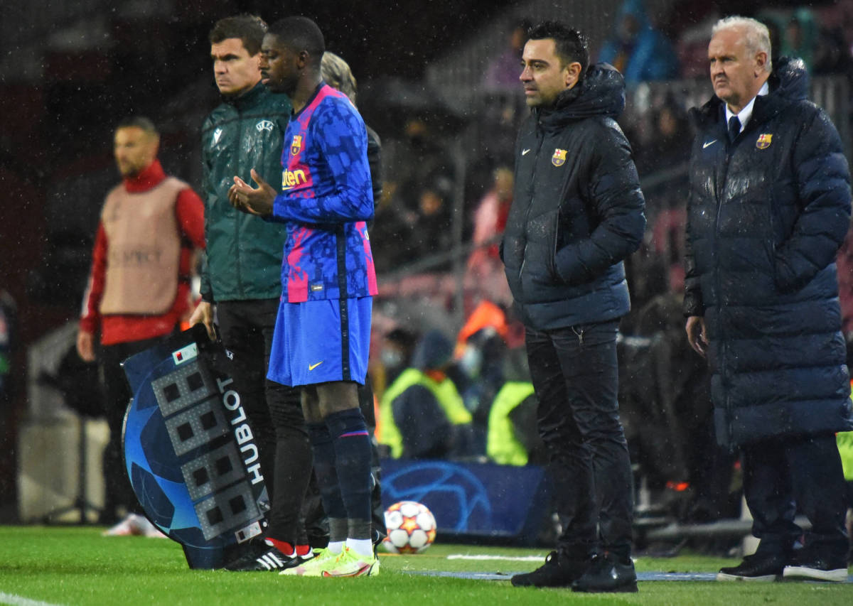 Xavi watches on as Ousmane Dembele prepares to enter Barcelona's game with Benfica as a sub in 2021