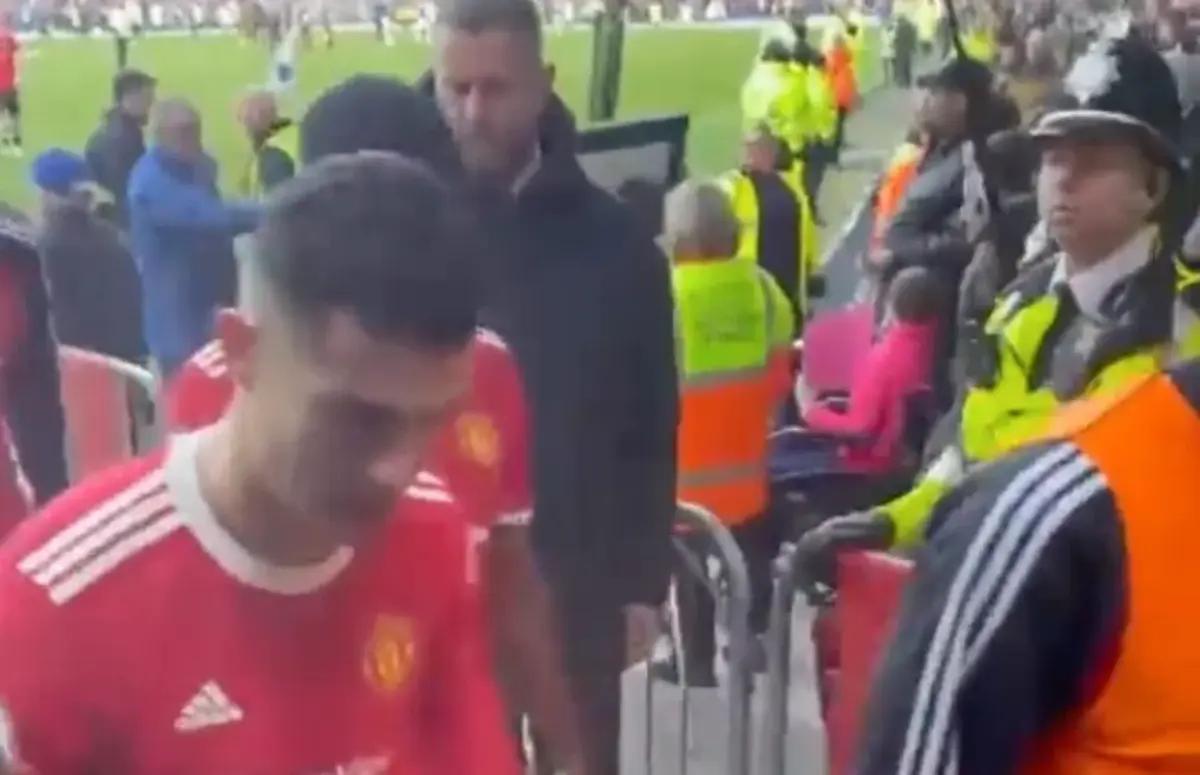 Cristiano Ronaldo pictured leaving the pitch at Everton's Goodison Park, where he was accused of smashing a fan's phone