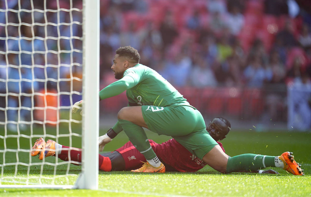 Sadio Mane scores for Liverpool after tackling Manchester City goalkeeper Zack Steffen during an FA Cup semi-final at Wembley in April 2022