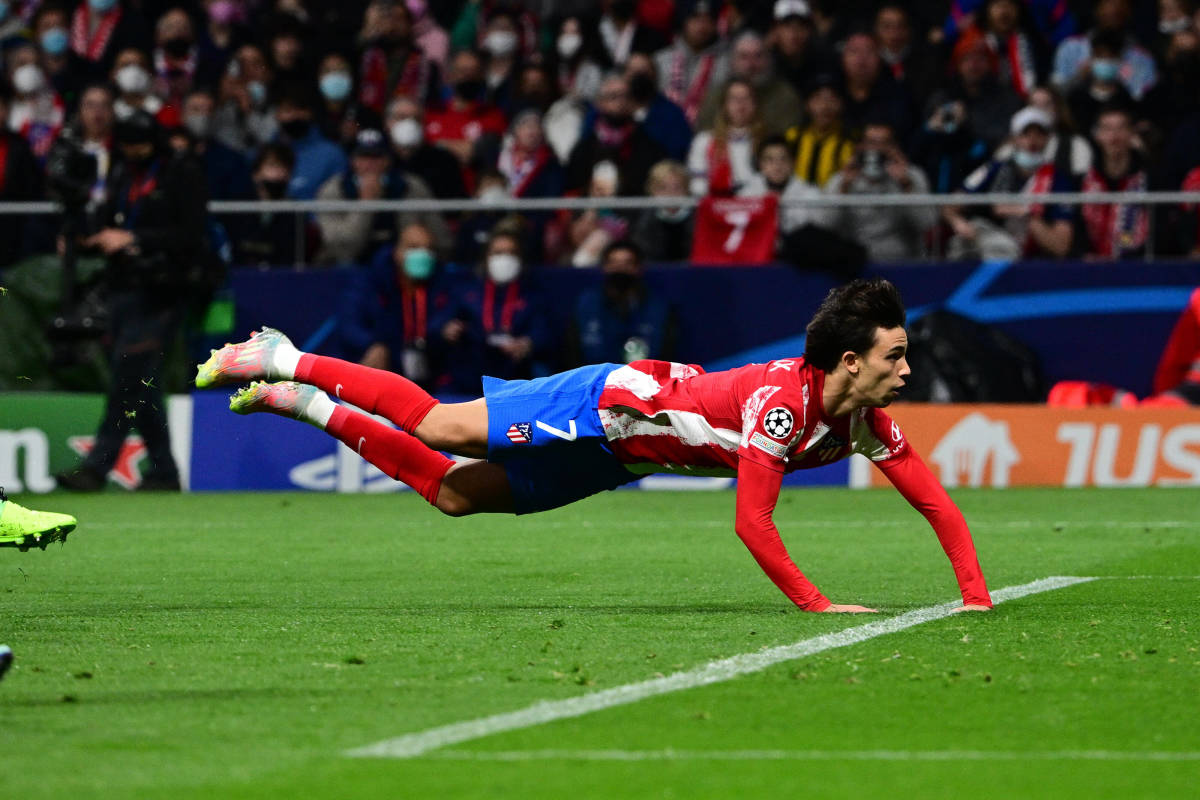 Joao Felix lands on the ground after scoring for Atletico Madrid with a diving header against Manchester United