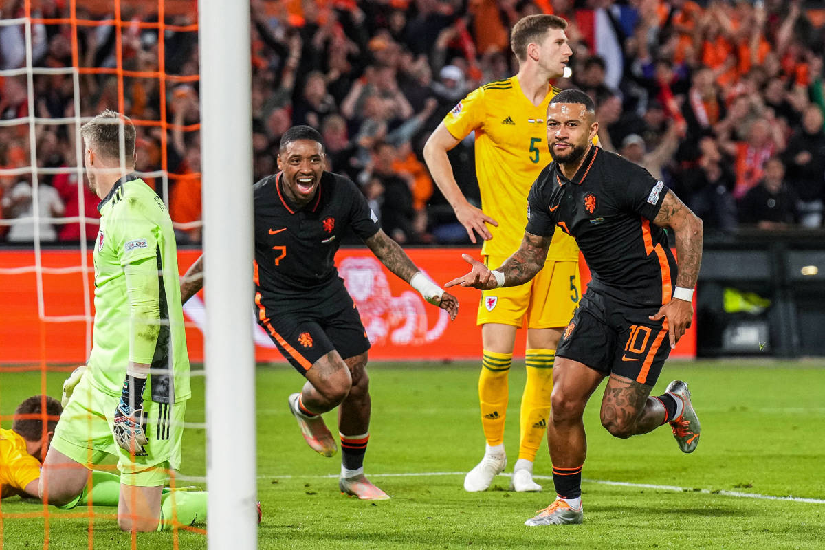 Memphis Depay pictured (right) after scoring the winning goal in Holland's 3-2 victory over Wales in June 2022