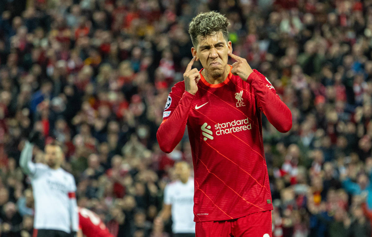 Roberto Firmino pictured celebrating after scoring for Liverpool against Benfica in the Champions League
