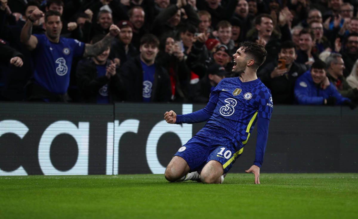 Christian Pulisic slides on his knees after scoring for Chelsea against Lille