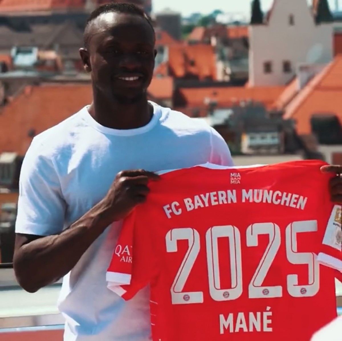 Sadio Mane pictured holding a Bayern Munich shirt after signing for the Bundesliga champions from Liverpool