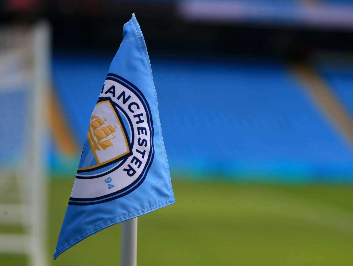 Manchester City's club crest is seen flying on a corner flag at the Etihad Stadium