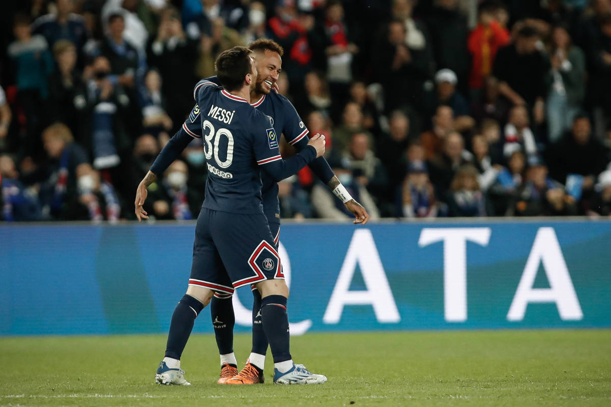 Lionel Messi celebrates with Neymar after scoring a goal to help PSG win the Ligue 1 title in April 2022