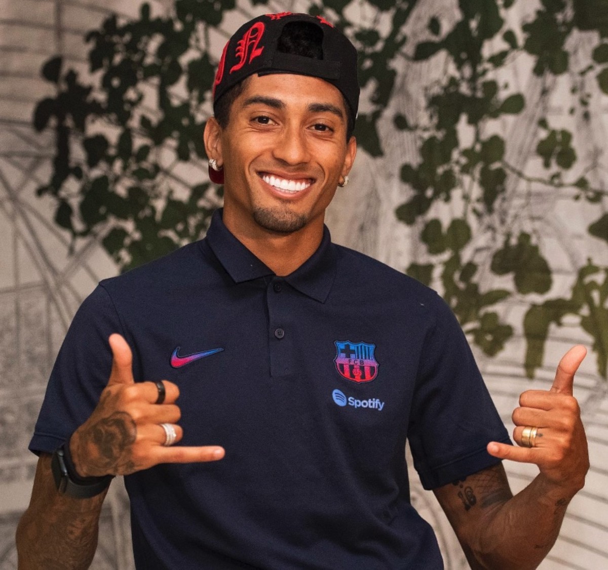 Raphinha pictured in a Barcelona polo shirt after arriving from Leeds United in a July 2022 transfer