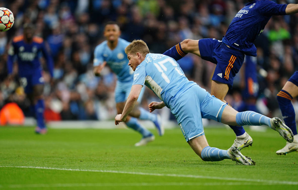 Kevin De Bruyne stoops to head Manchester City 1-0 ahead against Real Madrid at the Etihad Stadium in April 2022