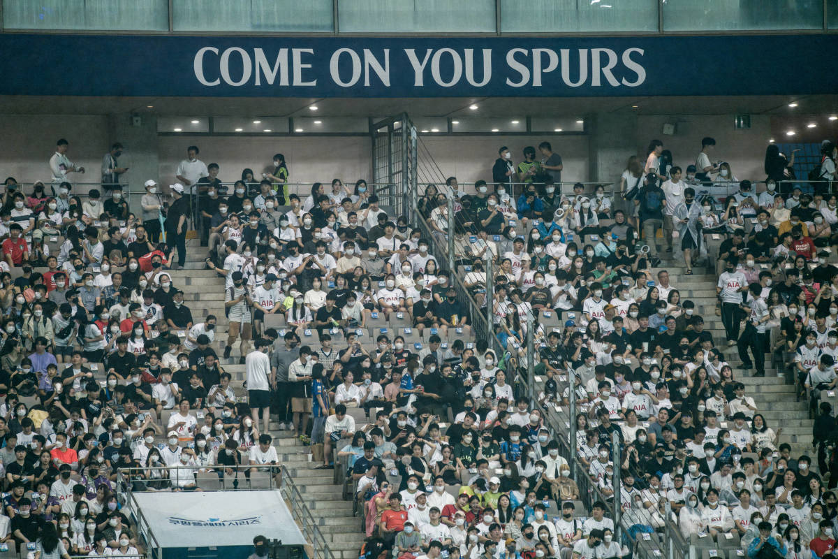 Fans in South Korea pictured supporting Tottenham Hotspur during their 2022 summer tour