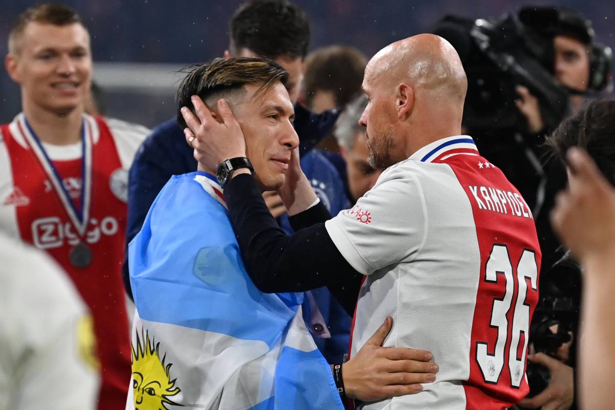 Erik ten Hag (right) and Lisandro Martinez pictured embracing after winning the Eredivisie title with Ajax in the 2021/22 season