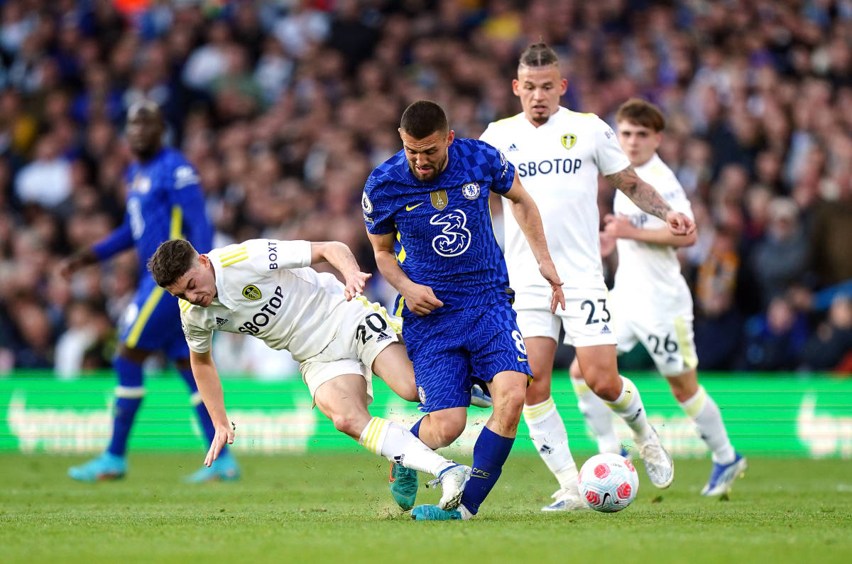 Leeds winger Dan James (left) pictured jumping into a bad tackle on Chelsea midfielder Mateo Kovacic
