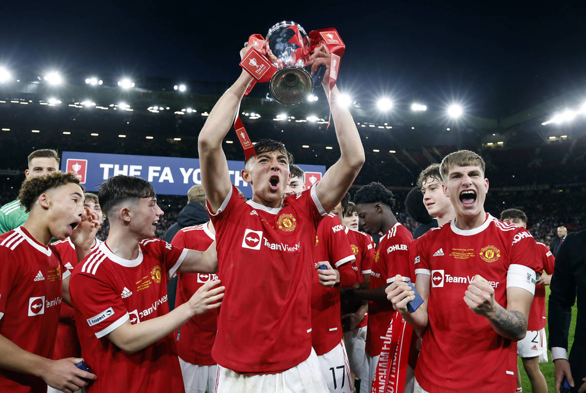 Manchester United's players celebrate winning the 2021/22 FA Youth Cup after beating Nottingham Forest 3-1 in the final at Old Trafford