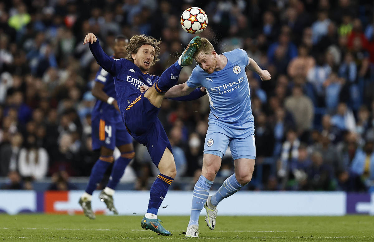 Luka Modric (left) pictured competing with Kevin De Bruyne during the first leg of Real Madrid's Champions League semi-final against Manchester City