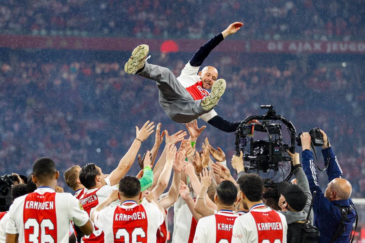 Erik ten Hag is thrown into the air by his Ajax players after guiding them to the Eredivisie title in May 2022