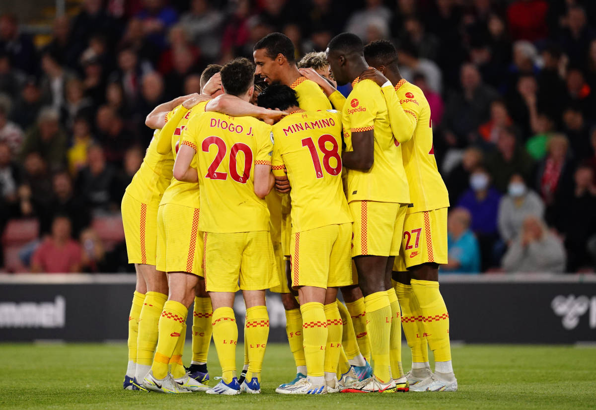 Liverpool's players huddle together in celebration after Joel Matip's winning goal in their 2-1 win at Southampton in May 2022