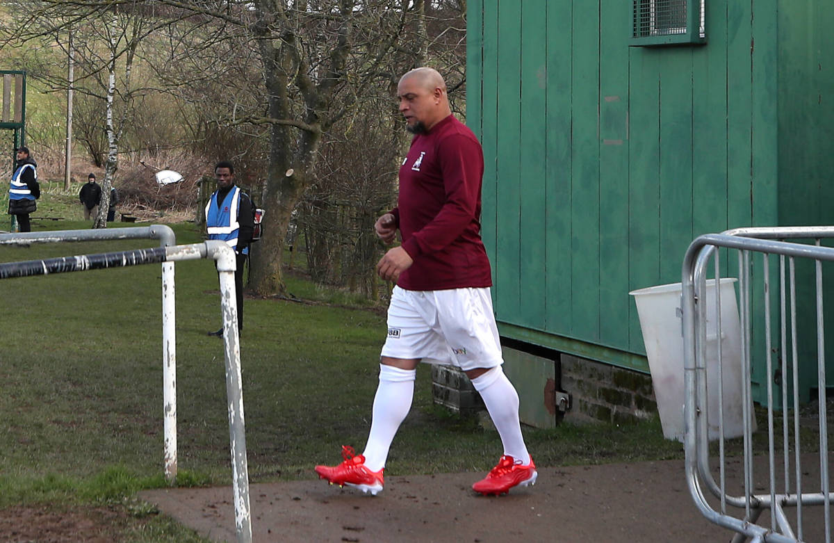 Roberto Carlos walks out onto the pitch to play for Bull In The Barne United