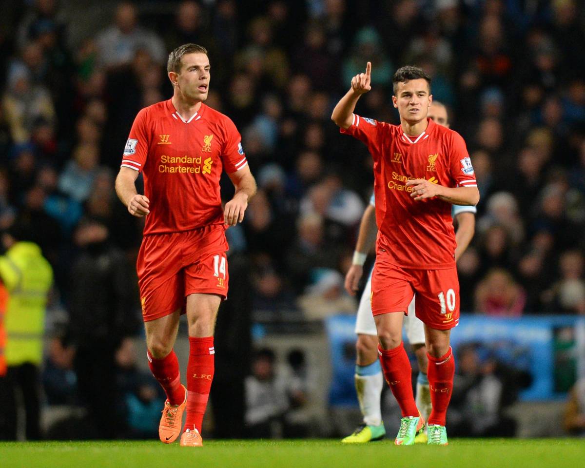 Philippe Coutinho (right) pictured celebrating after scoring for Liverpool against Manchester City at the Etihad Stadium in 2013