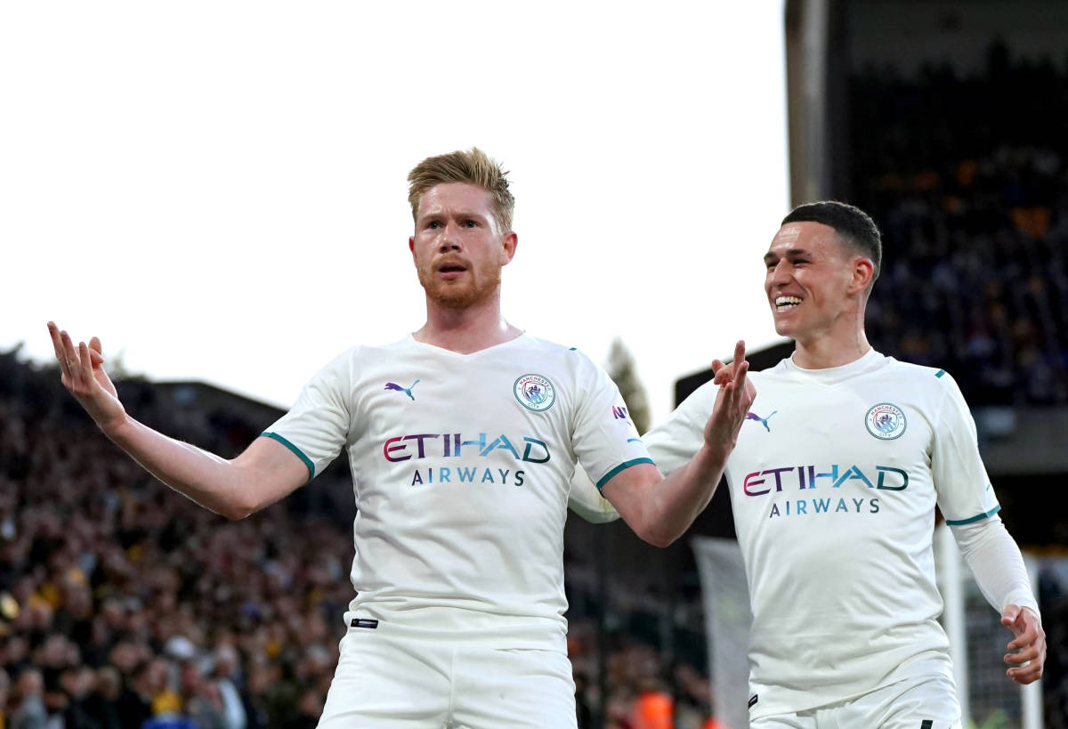Kevin De Bruyne (left) pictured celebrating in the style of Erling Haaland after scoring for Man City against Wolves in May 2022