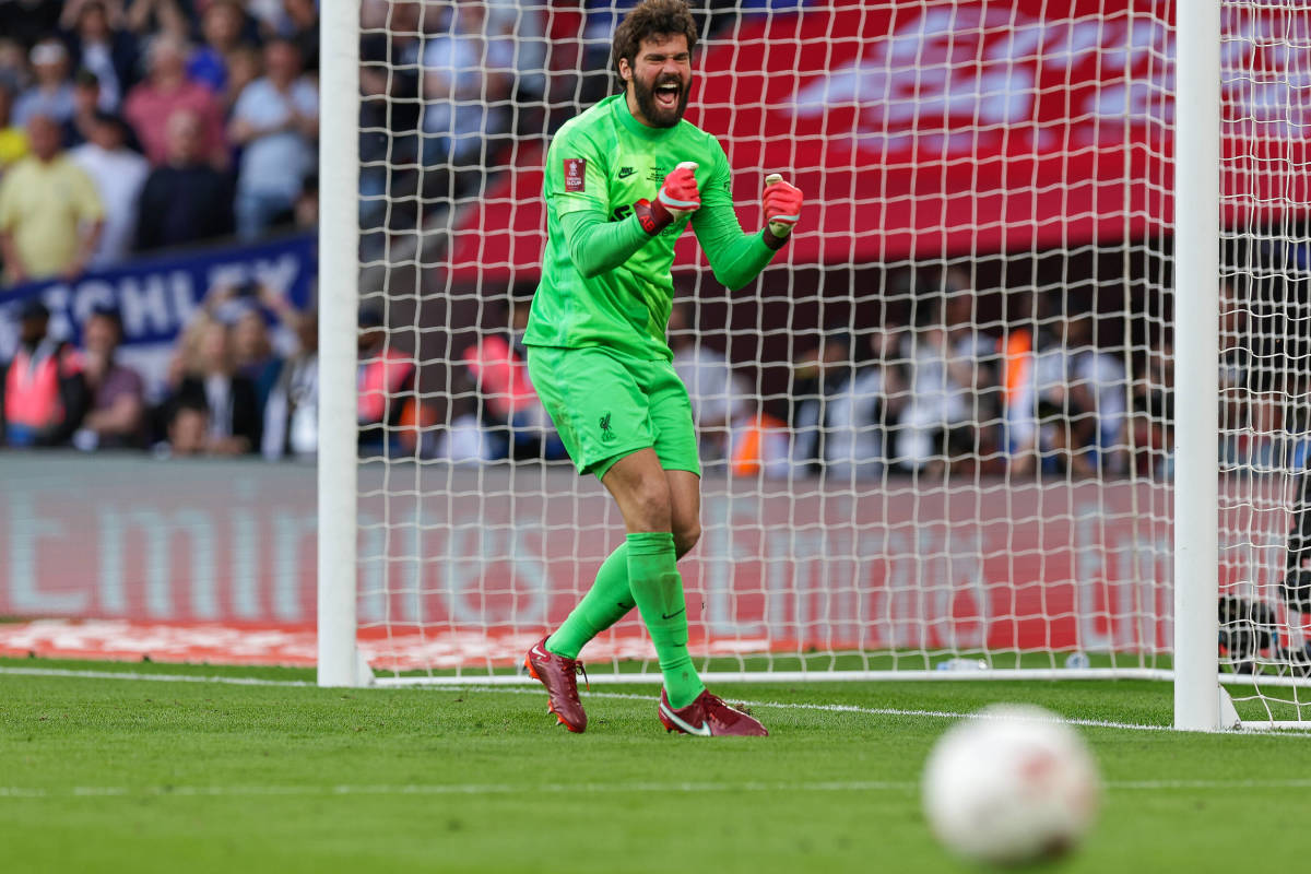 Liverpool goalkeeper Alisson Becker pictured celebrating after making a save in the penalty shootout at the end of the 2022 FA Cup final against Chelsea