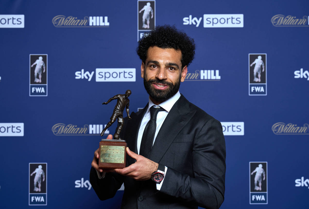 Liverpool forward Mo Salah pictured holding his trophy after being named as the FWA's Footballer of the Year in May 2022