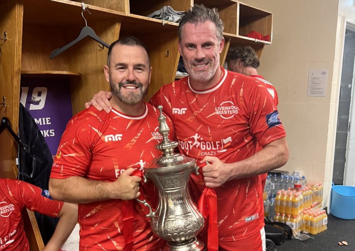 David Thompson (left) and Jamie Carragher pictured holding the Masters Cup trophy after winning the tournament with Liverpool in 2022