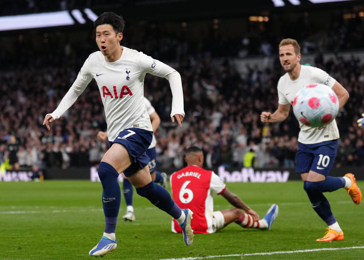 Son Heung-min (left) pictured celebrating after scoring in Tottenham's 3-0 win over Arsenal in May 2022