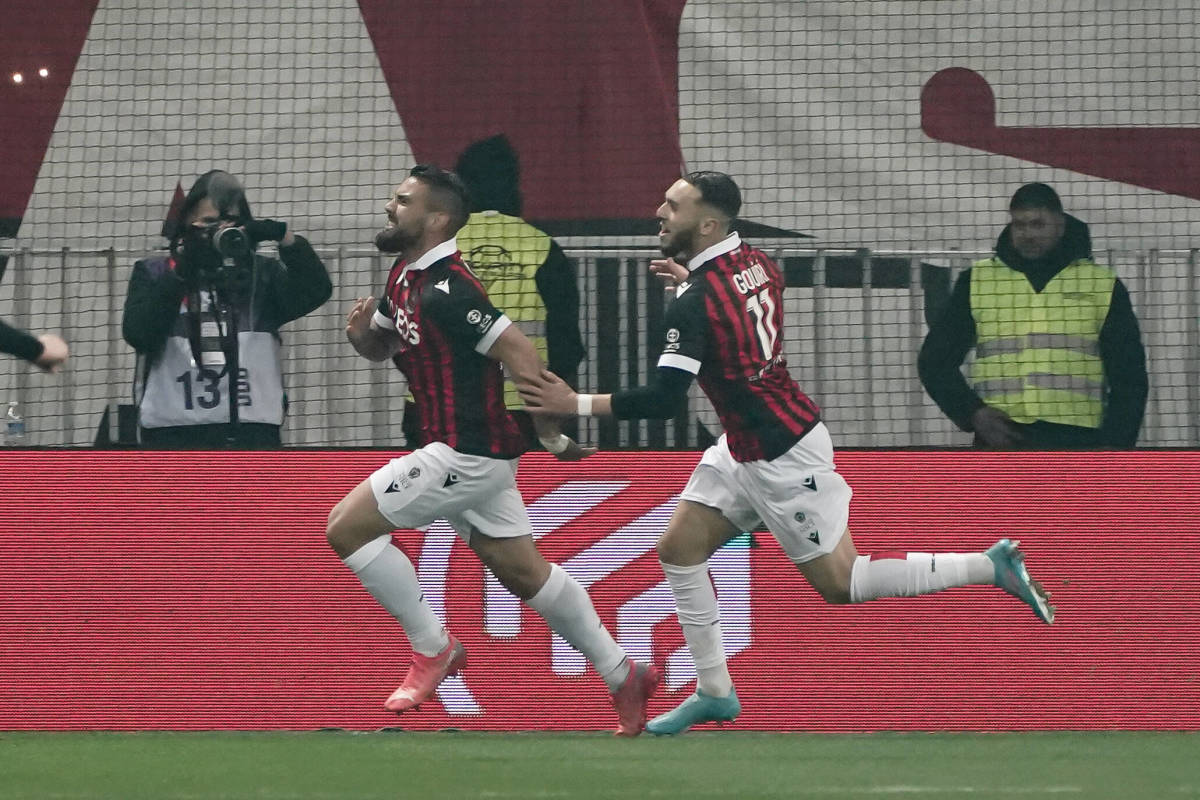 Andy Delort celebrates scoring Nice's winning goal against PSG as teammate Amine Gouiri (right) chases after him