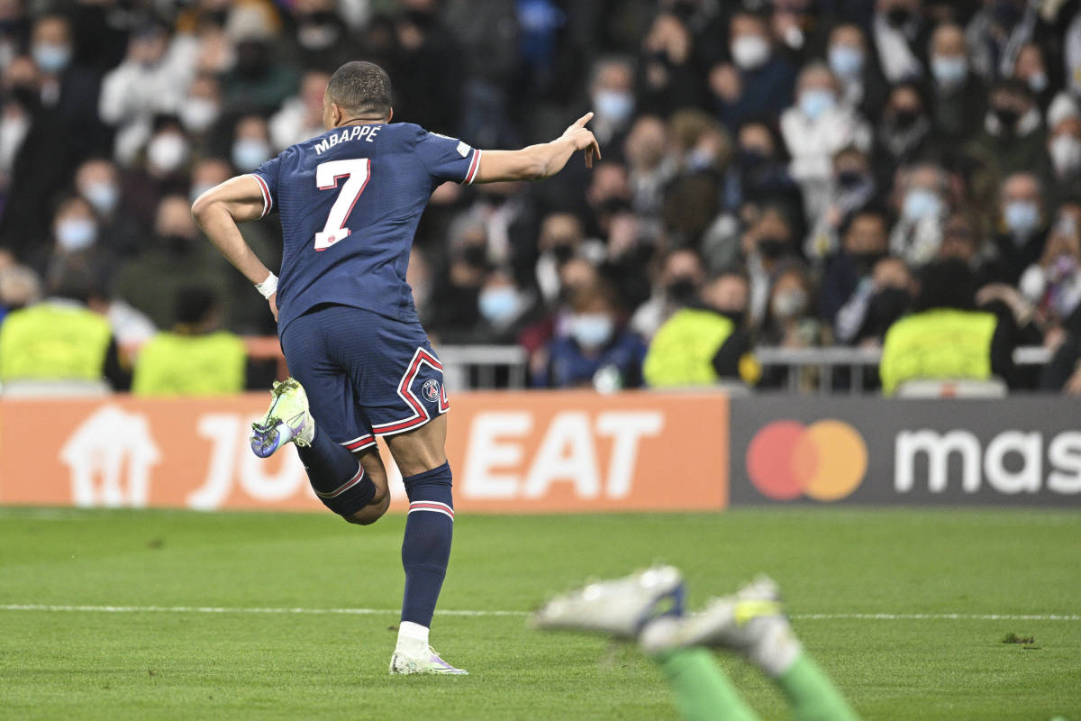 Kylian Mbappe runs away to celebrate after scoring for PSG against Real Madrid at the Bernabeu