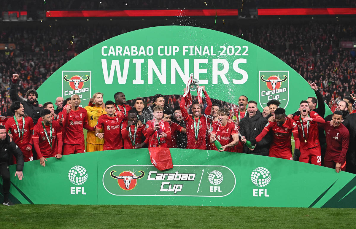 Liverpool's players celebrate with the EFL Cup trophy after beating Chelsea in the 2022 final