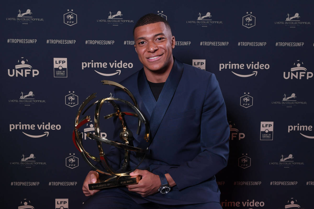 Kylian Mbappe pictured with his trophy after being named as the 2021/22 Ligue 1 Player of the Season
