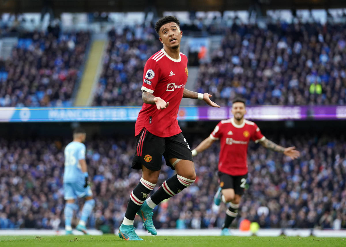 Jadon Sancho pictured celebrating a goal for Man United at former club Man City in March 2022