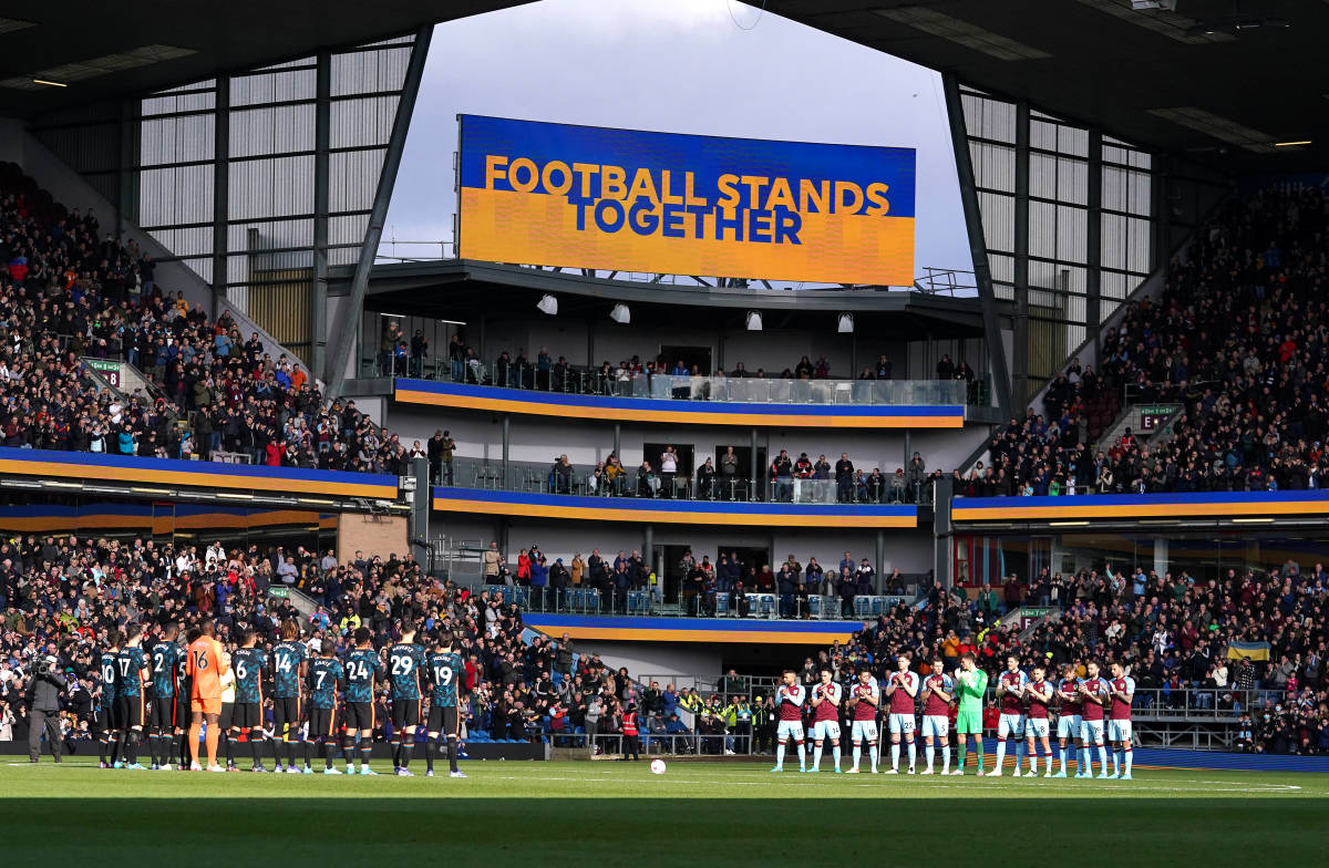 Burnley and Chelsea players join fans in showing solidarity with the people of Ukraine ahead of their game at Turf Moor in March 2022
