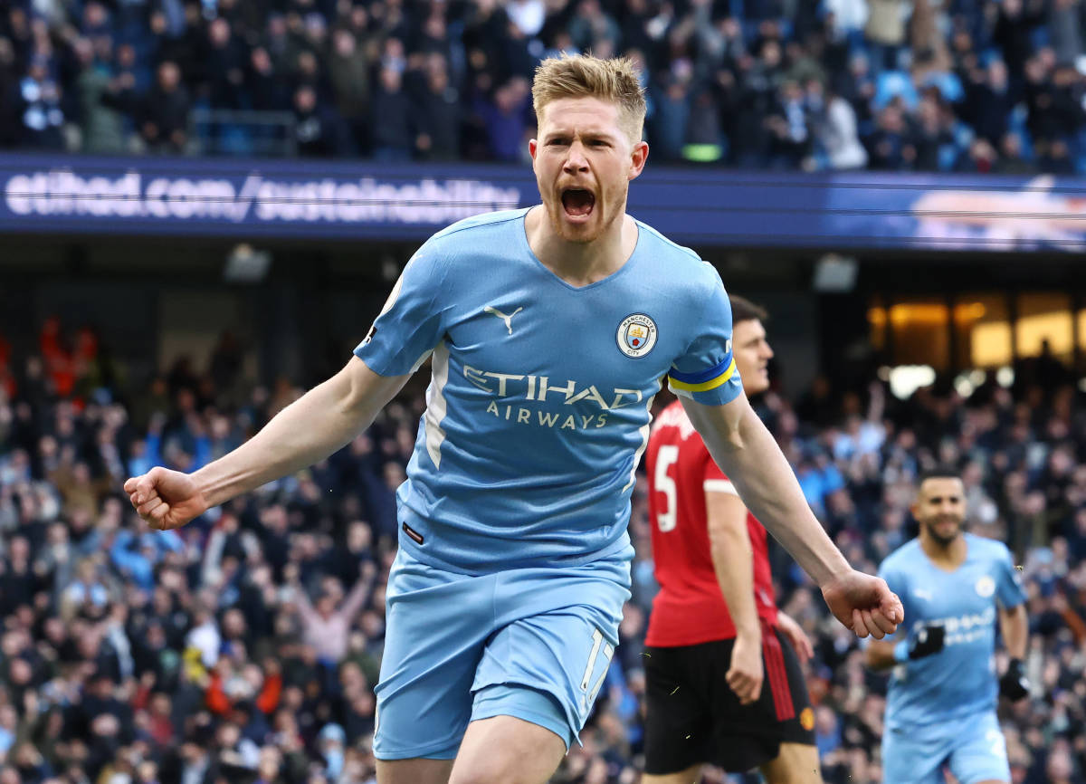 Kevin De Bruyne celebrates scoring in Man City's derby win over Man United in March 2022