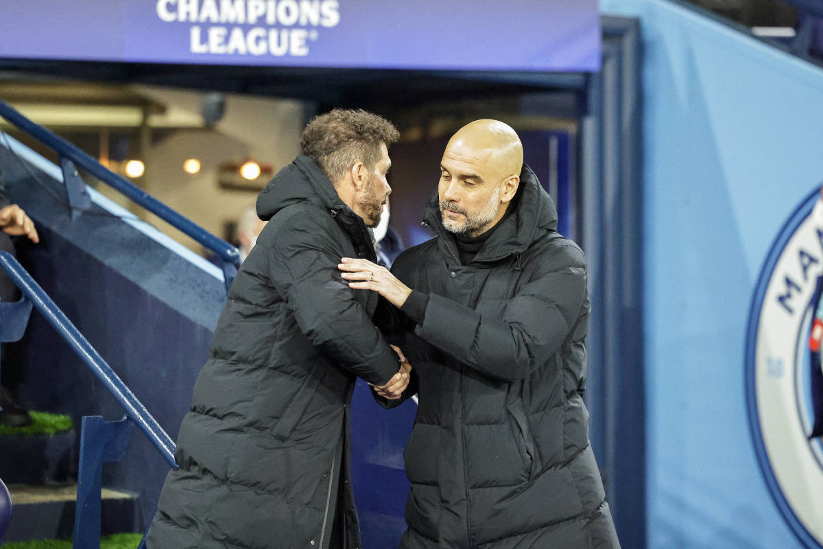 Diego Simeone and Pep Guardiola pictured shaking hands at Manchester City's game against Atletico Madrid in April 2022